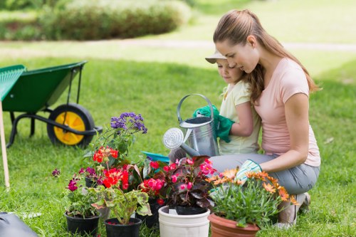 Landscapers maintaining a clean, safe work area during final clearance